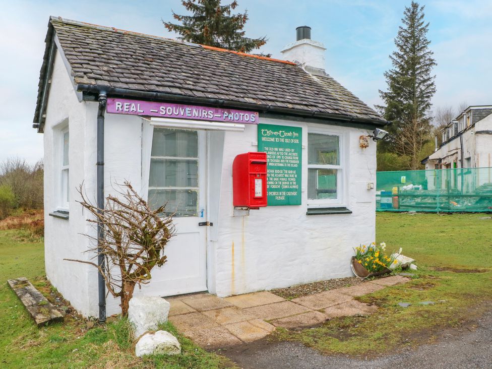 An exterior view of a cottage with a red post box at 3 Whin Bank, Clachan-Seil near Balvicar, Isle Of Seil