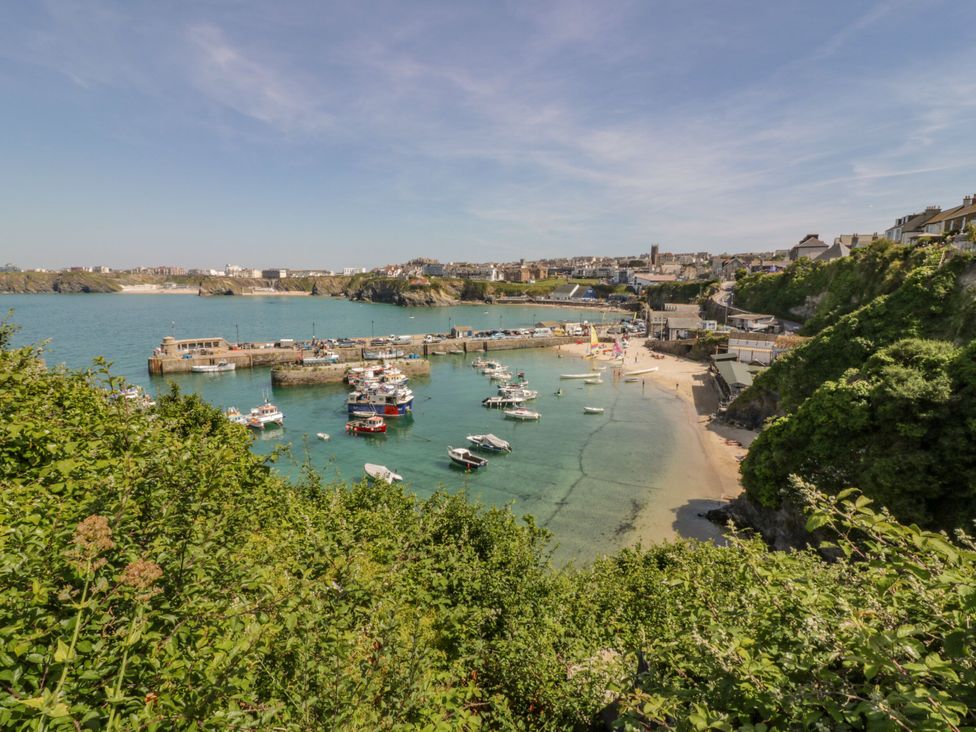 A coastal view with boats in the harbor at Lazy Days St Merryn