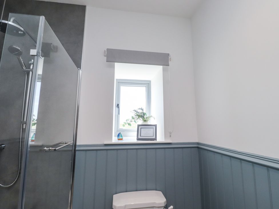 A bathroom with a shower and toilet at West Burton Hemmel in Bamburgh