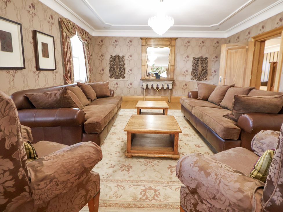 A living room with sofas and a coffee table at Mount House in Bryniau near Dyserth