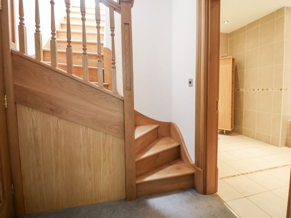 A staircase leading to upper floors at Mount House Bryniau near Dyserth