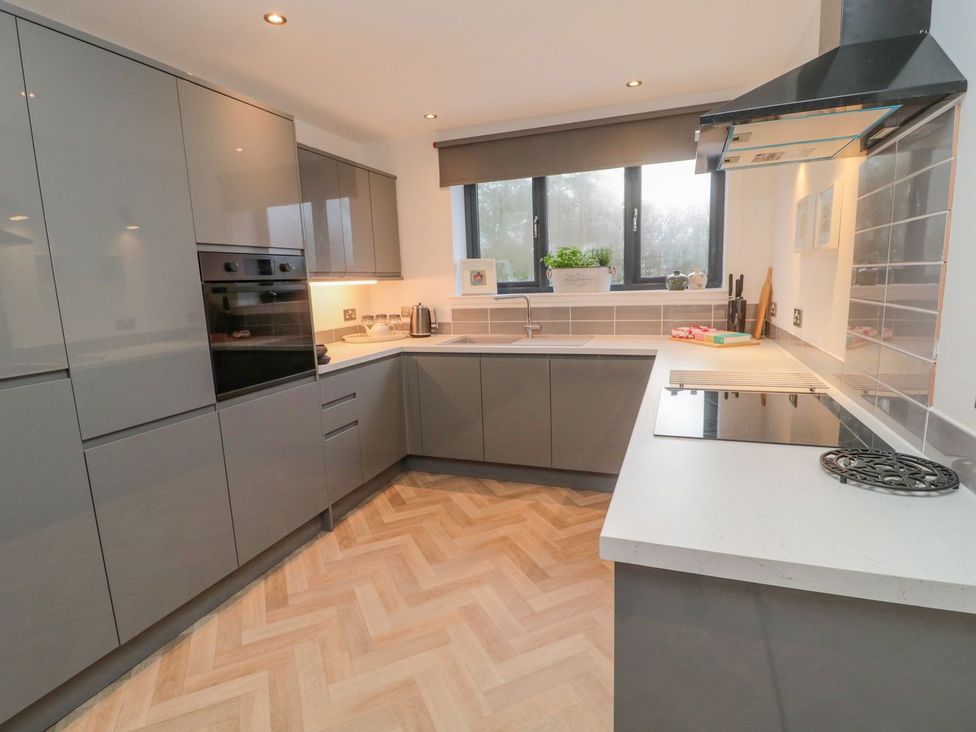 A kitchen with modern units and appliances at Harvest Cottage 1 in Berwick-upon-Tweed