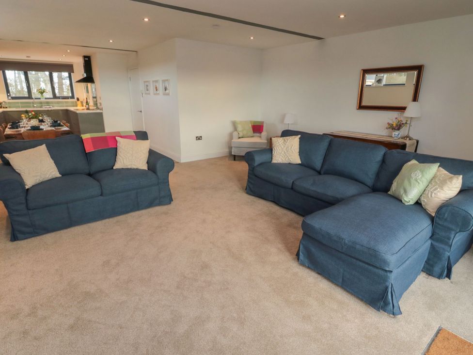 A living room with sofas and a side table at Harvest Cottage 2 Berwick-upon-Tweed