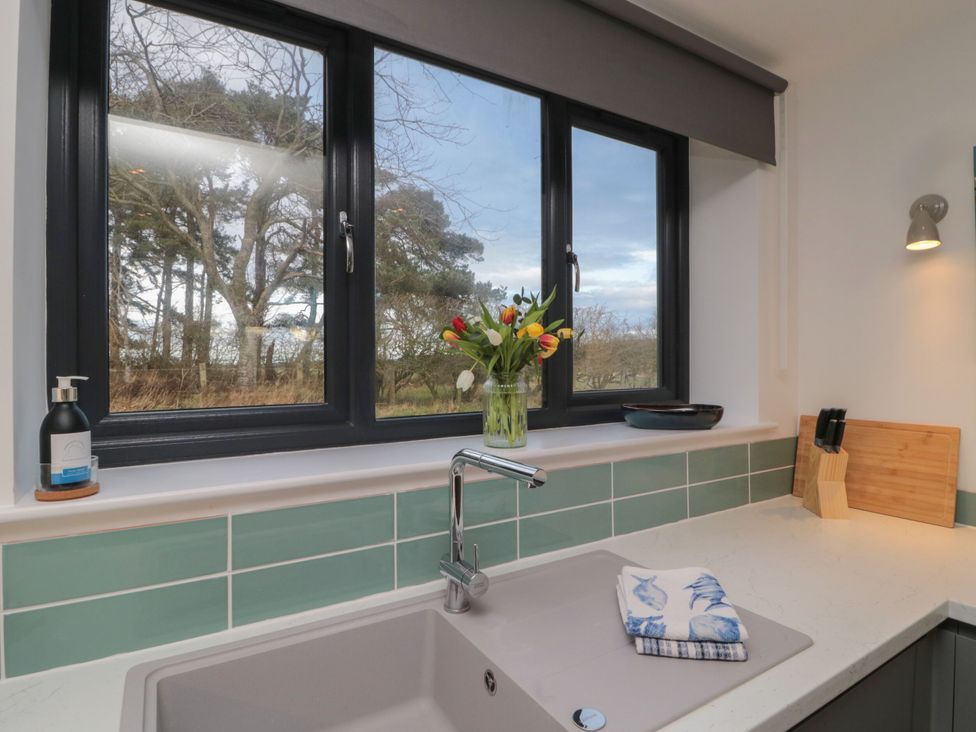 A kitchen with a sink under a window at Harvest Cottage 2 Berwick-upon-Tweed