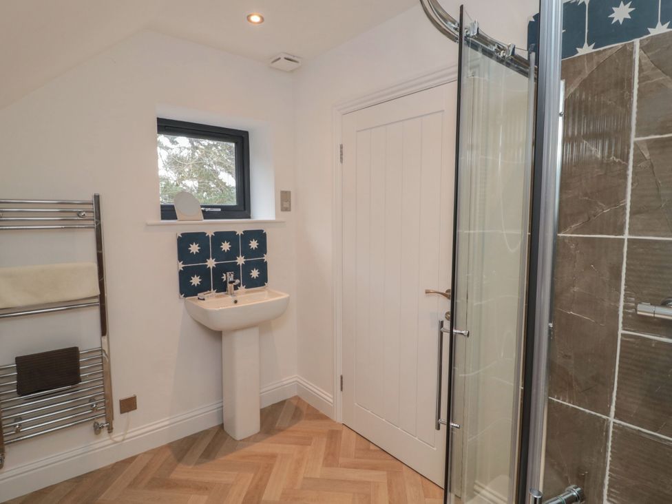 A bathroom with a sink and shower at Harvest Cottage 2 in Berwick-upon-Tweed