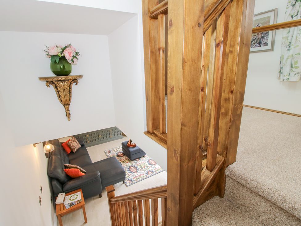 A landing area with a sofa and coffee table at Sylva Cottage in Burlton near Cockshutt
