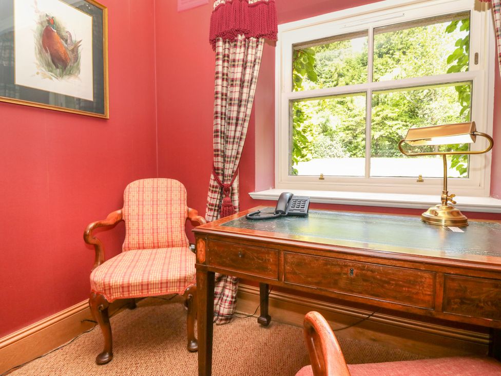 A study with a desk and telephone at Claybockie, Mar Lodge near Braemar