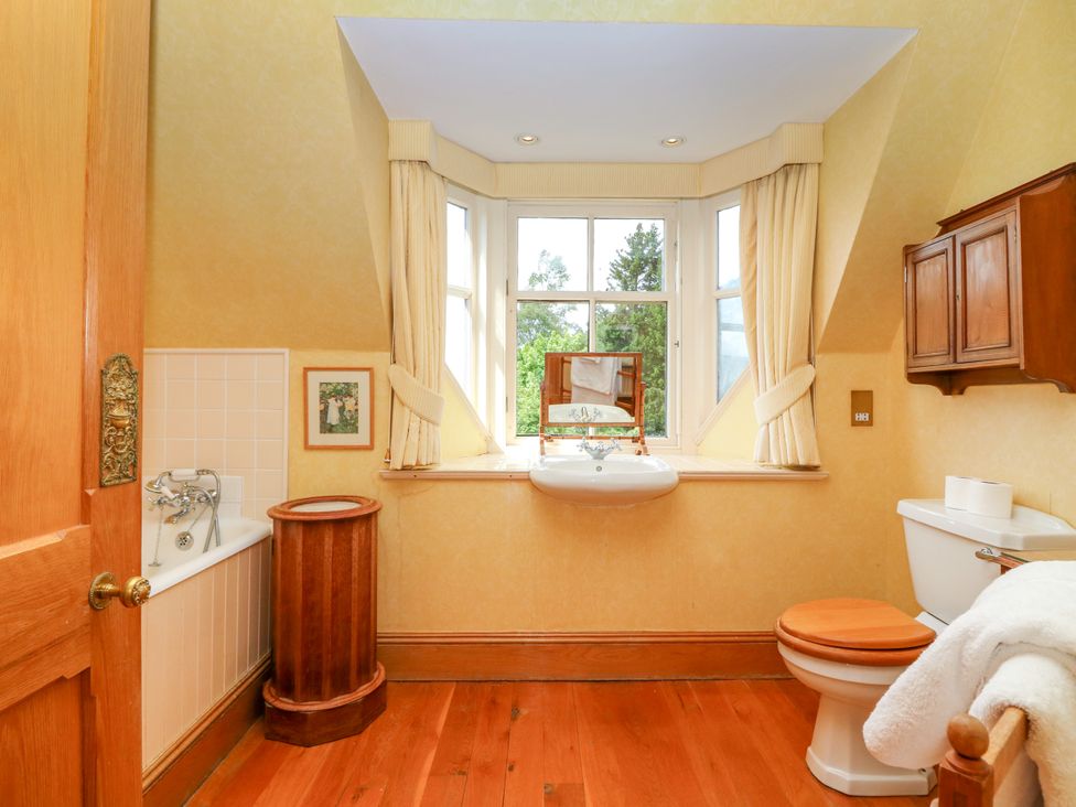 A bathroom with a sink, bathtub, and toilet at Claybockie, Mar Lodge near Braemar
