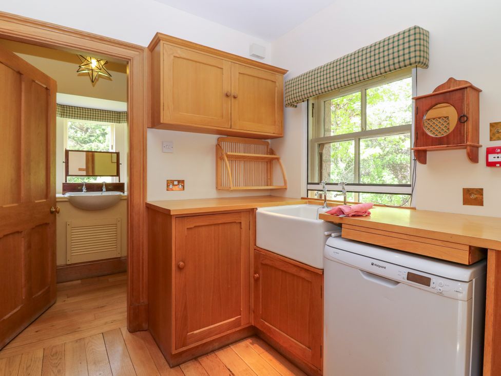 A kitchen featuring a sink and dishwasher at Claybockie, Mar Lodge near Braemar