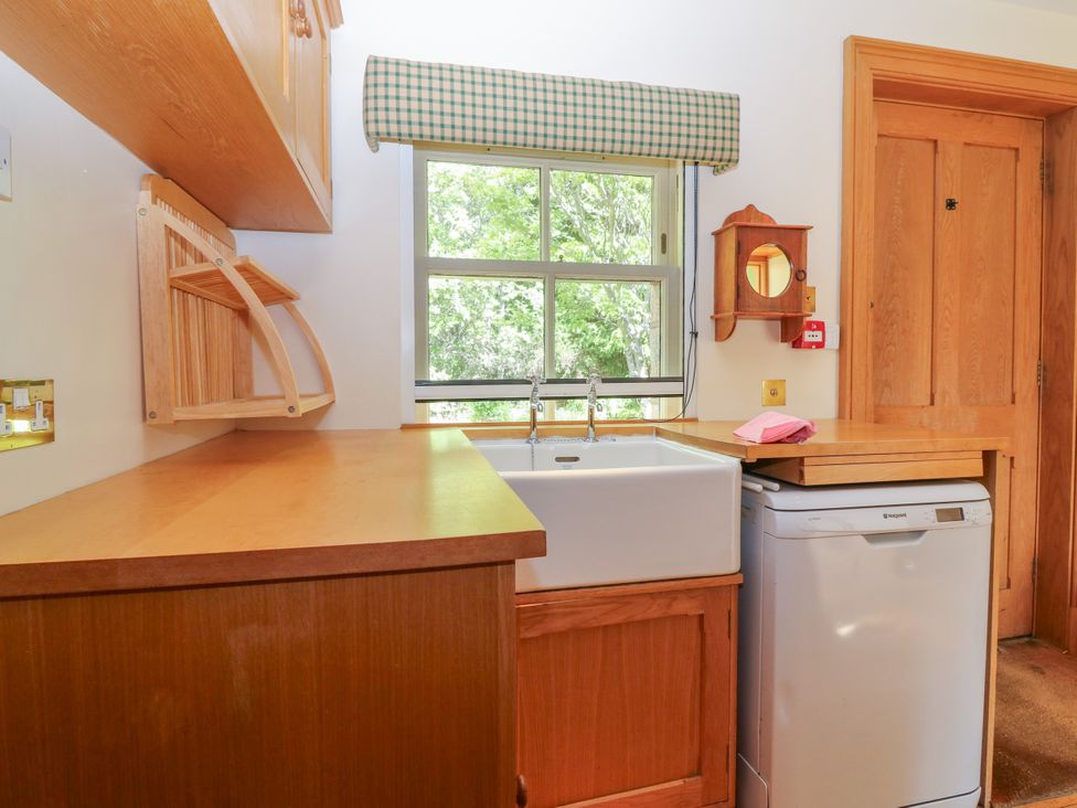 A kitchen with a sink and dishwasher at Claybockie near Mar Lodge in Braemar