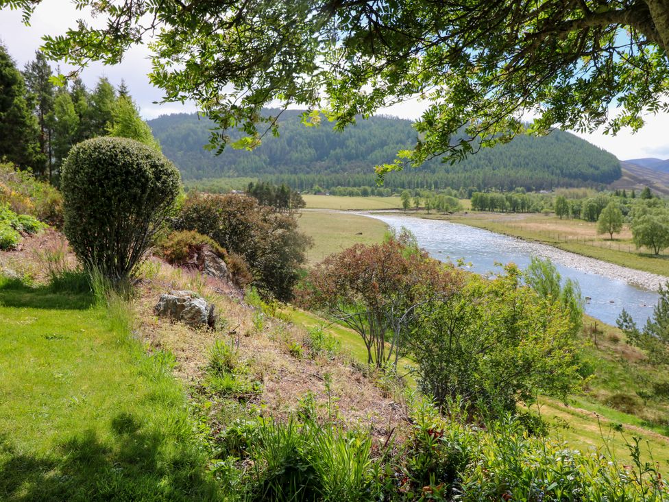 View of a river and hillside at Claybockie Mar Lodge near Braemar