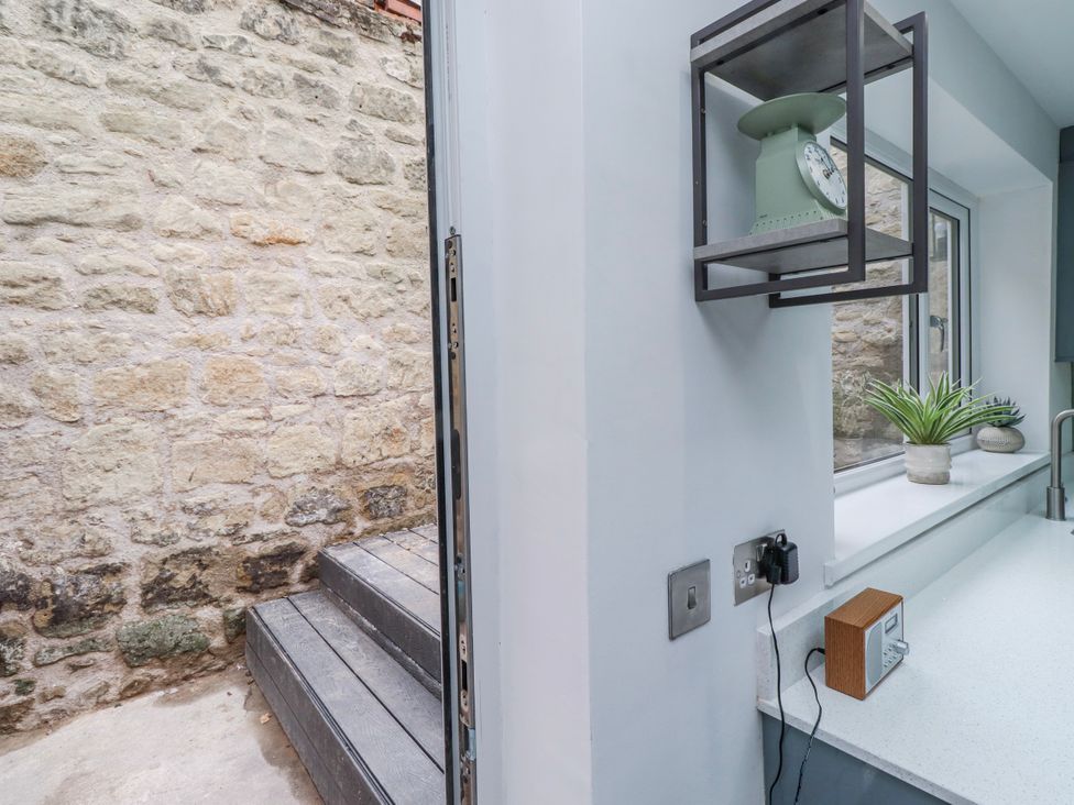 A kitchen with stairs leading outside at 3 Lisburn Street Alnwick