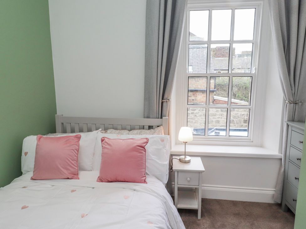 A bedroom with a bed and window at 3 Lisburn Street Alnwick