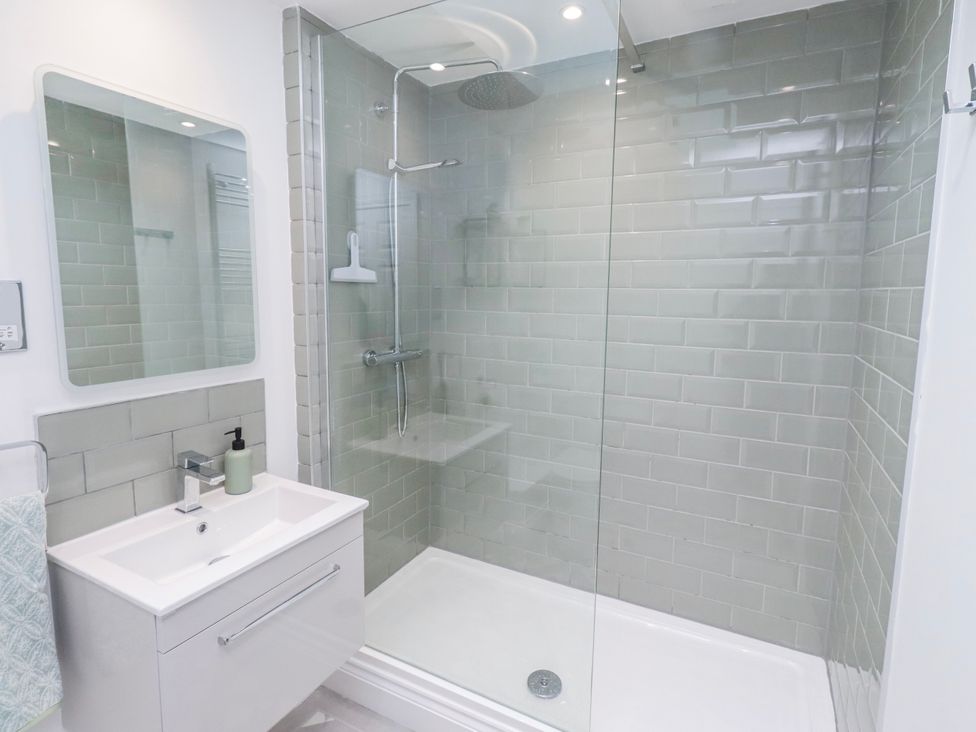 A bathroom with a shower and sink at 3 Lisburn Street Alnwick
