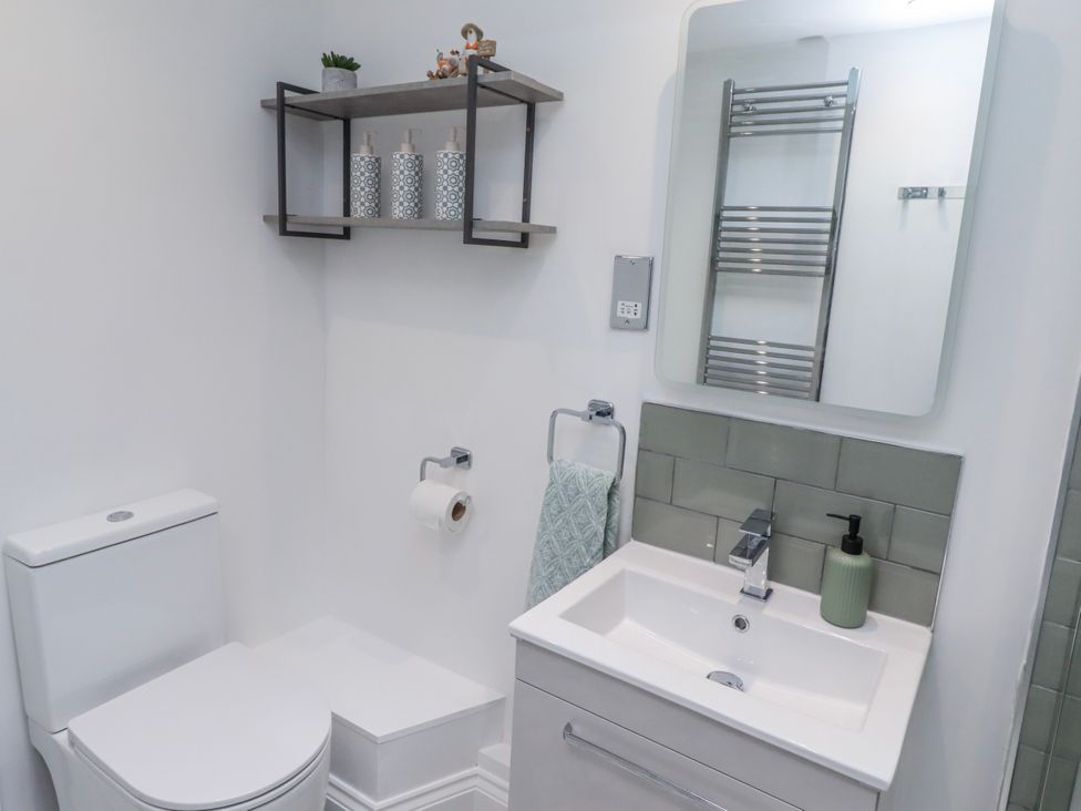 A bathroom with a toilet and sink at 3 Lisburn Street Alnwick