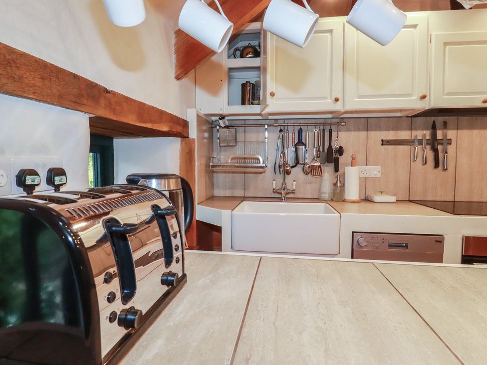 A kitchen with a toaster, kettle, and sink at Stribleys Barn in Cusgarne near St Day