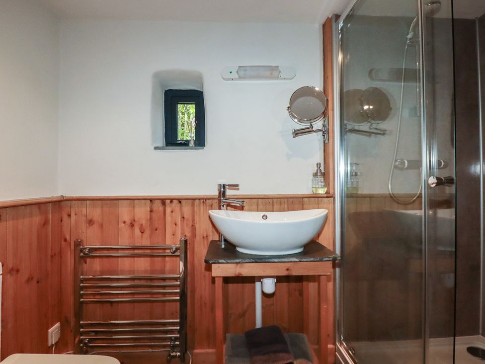 A bathroom with a sink and shower at Stribleys Barn Cusgarne near St Day