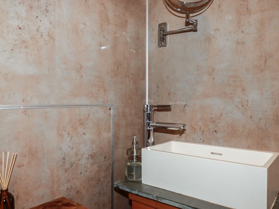 A bathroom with a sink and faucet at Stribleys Barn Cusgarne near St Day