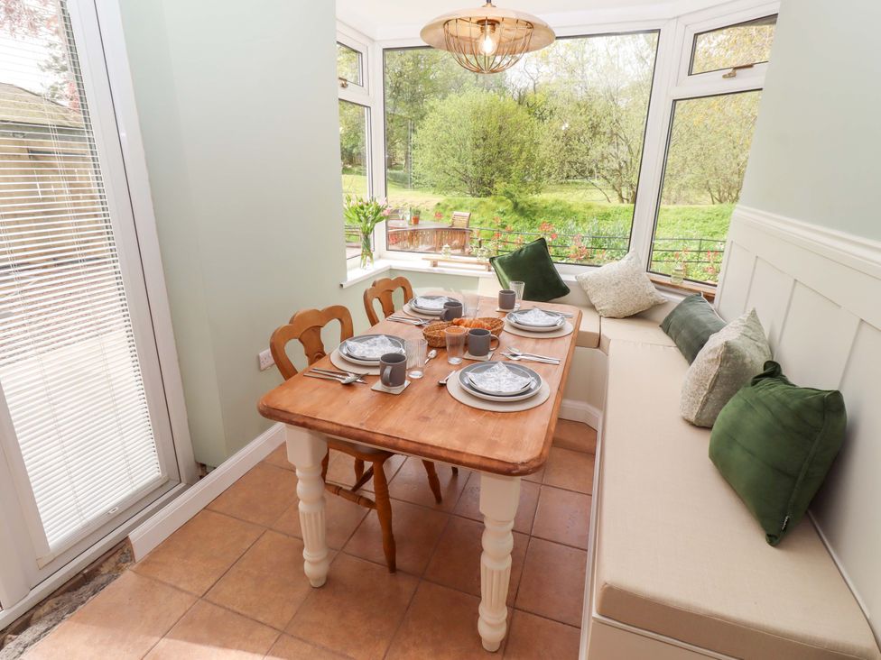A dining room with a table and chairs at The Lodge in Powburn