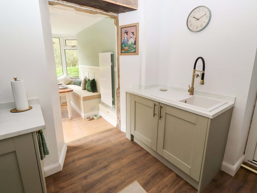 A kitchen with a sink and cabinets at The Lodge in Powburn