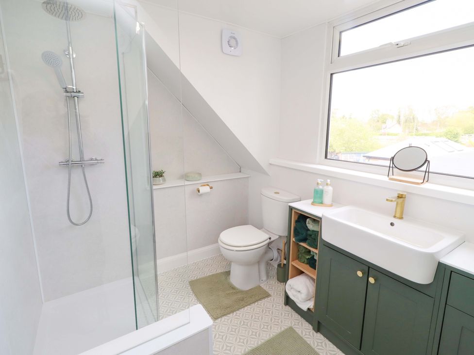 A bathroom with a shower and sink at The Lodge in Powburn