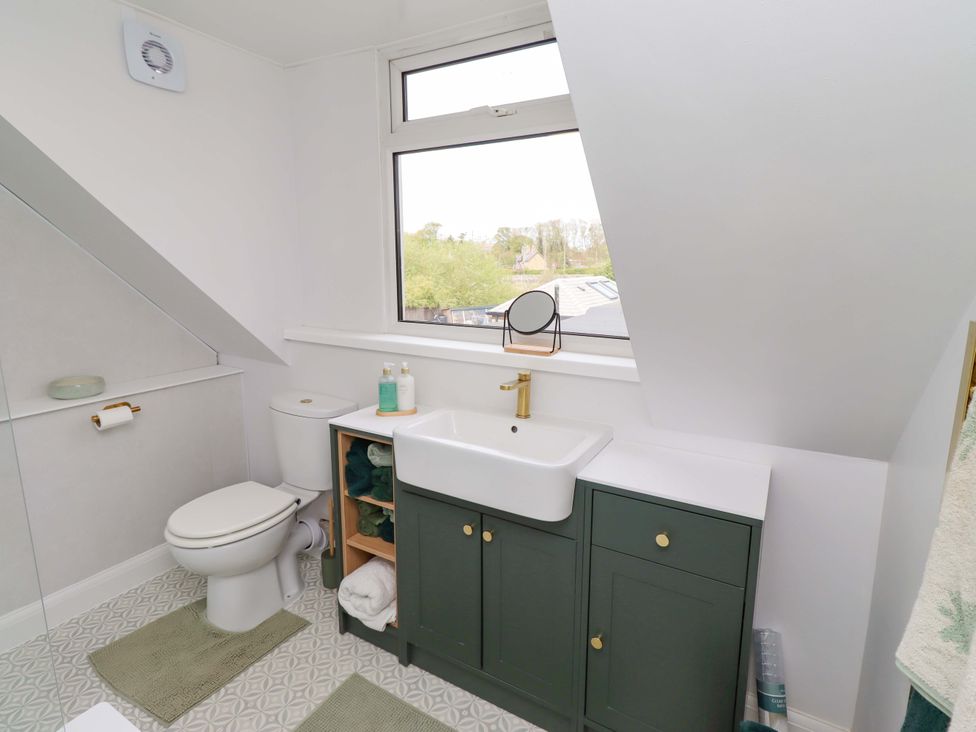 A bathroom with a sink and toilet at The Lodge in Powburn