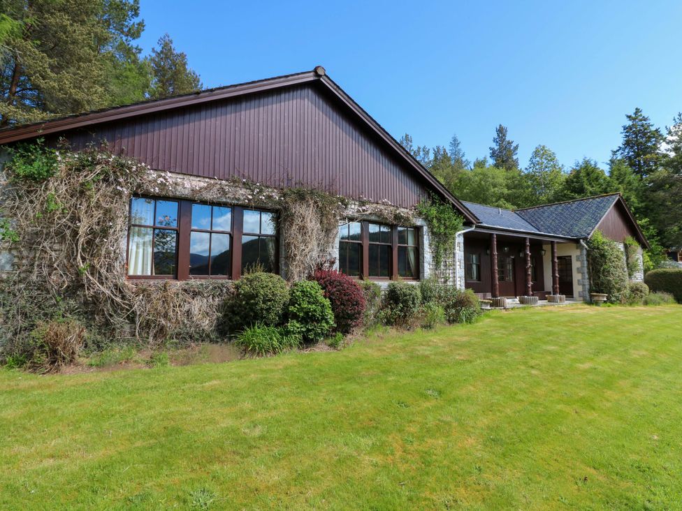 A house with windows and garden at Creag Bhalg Mar Lodge near Braemar