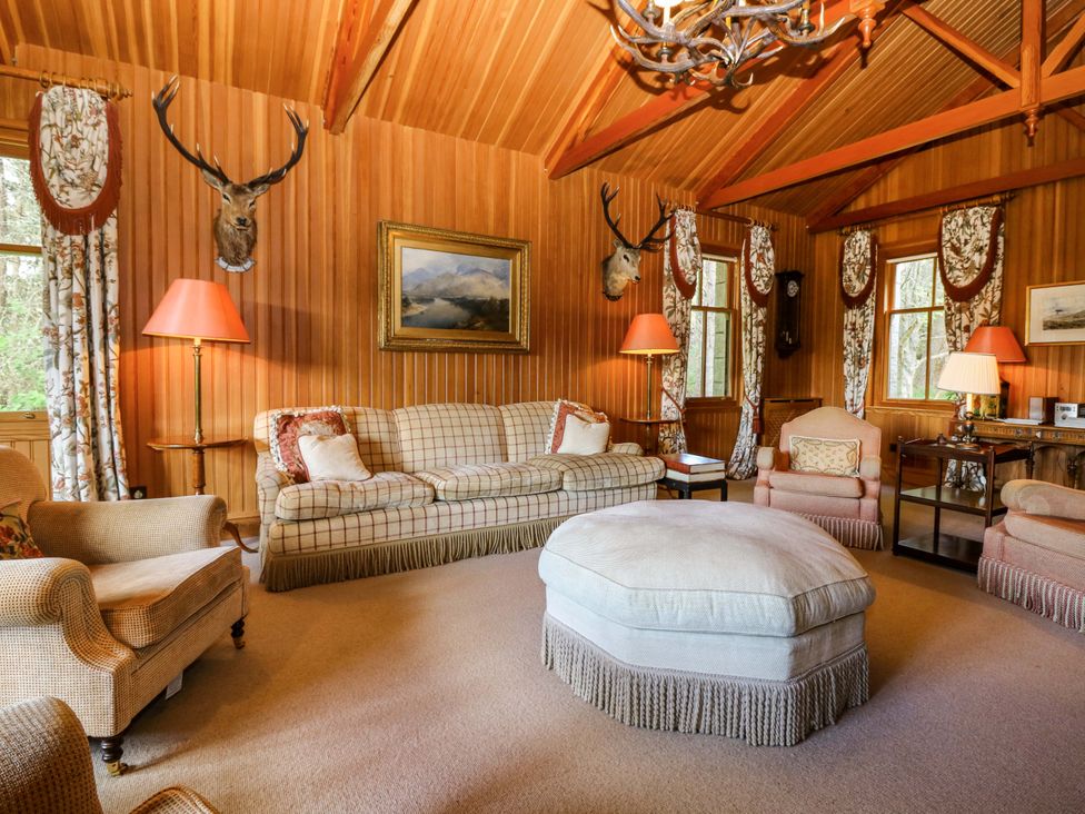 A living room with a sofa and chairs at Creag Bhalg near Braemar