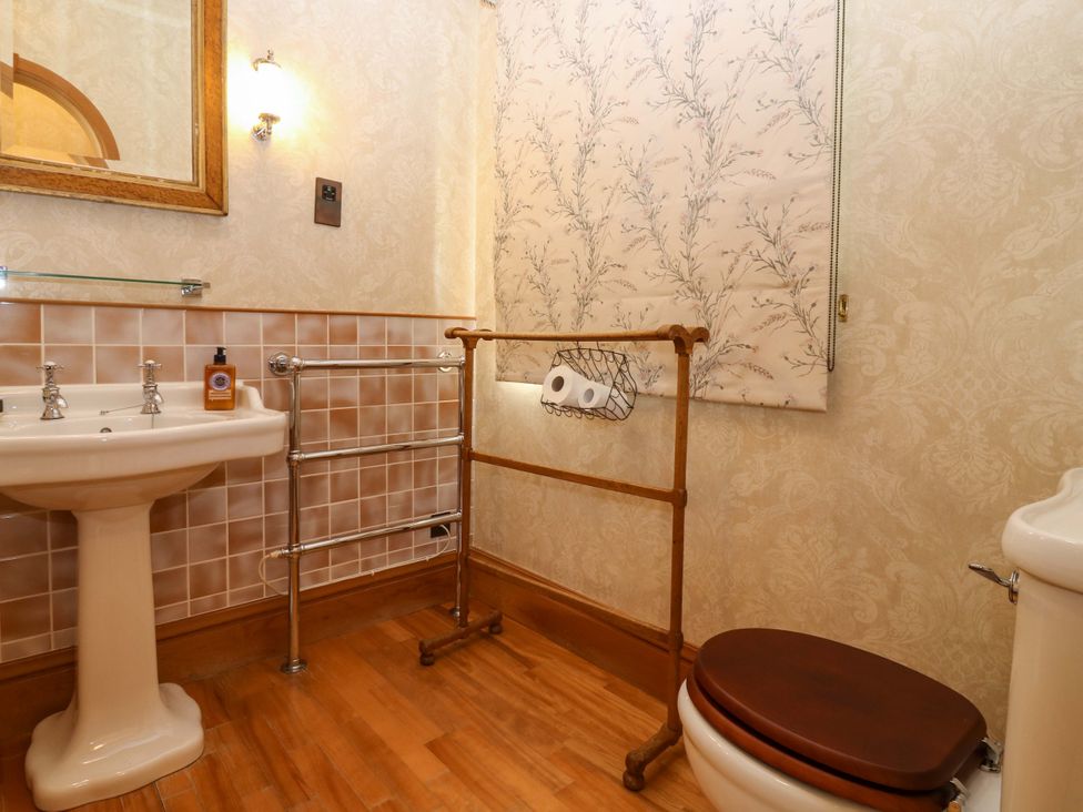 A bathroom with a sink and toilet at Creag Bhalg near Mar Lodge in Braemar