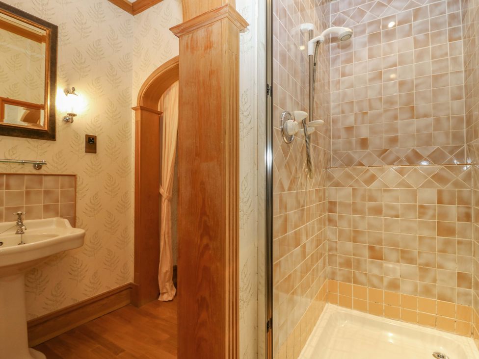 A bathroom with sink and shower at Creag Bhalg near Mar Lodge in Braemar