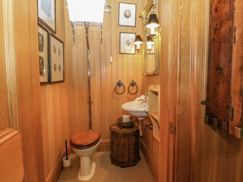 A bathroom with a toilet and sink at Creag Bhalg near Mar Lodge