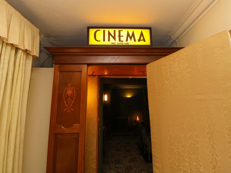 A home cinema entrance with a sign at Mickle Trafford Manor in Chester