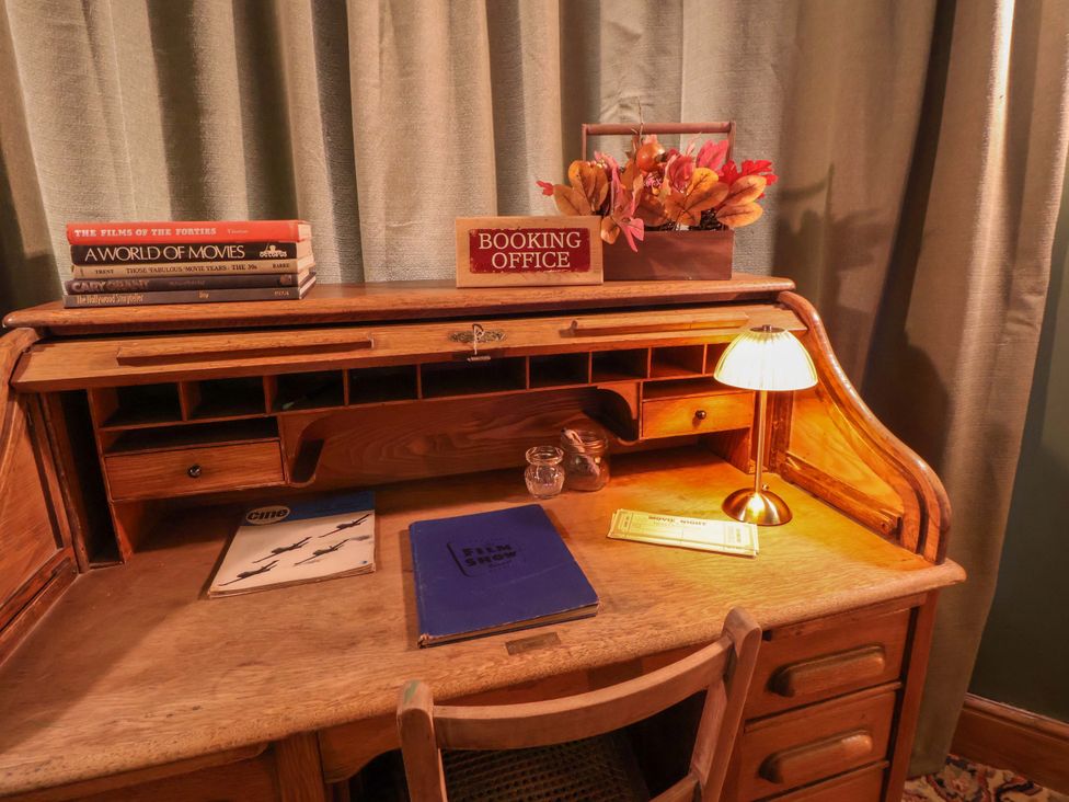An office desk with a lamp and books at Mickle Trafford Manor in Chester