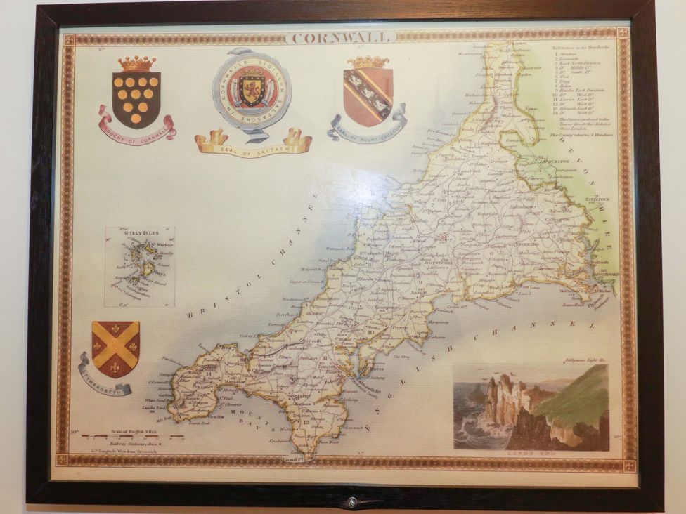 A map of Cornwall with coats of arms and illustration at 1 Vetch Avenue St Austell