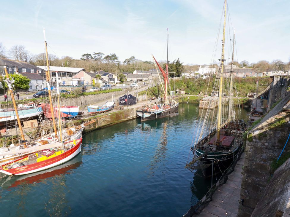 A harbor with boats and buildings at 1 Vetch Avenue St Austell