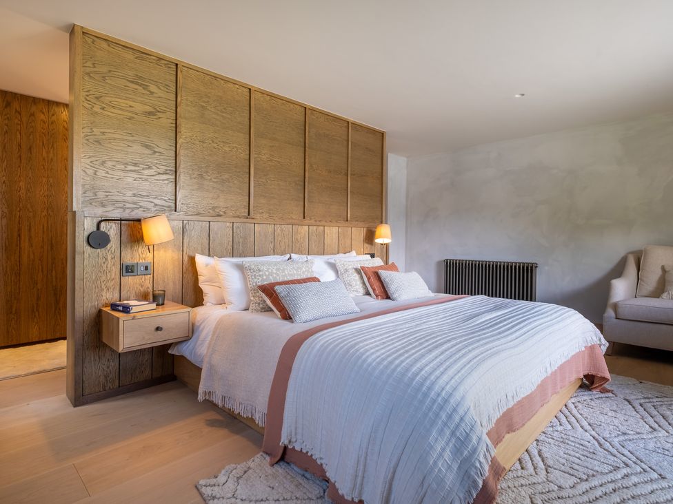 A bedroom with a bed and nightstand at Deer Close in Coniston