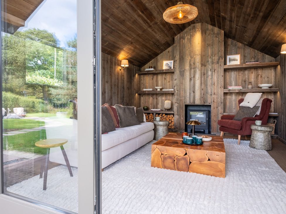 A living room with a sofa and a coffee table at Deer Close in Coniston