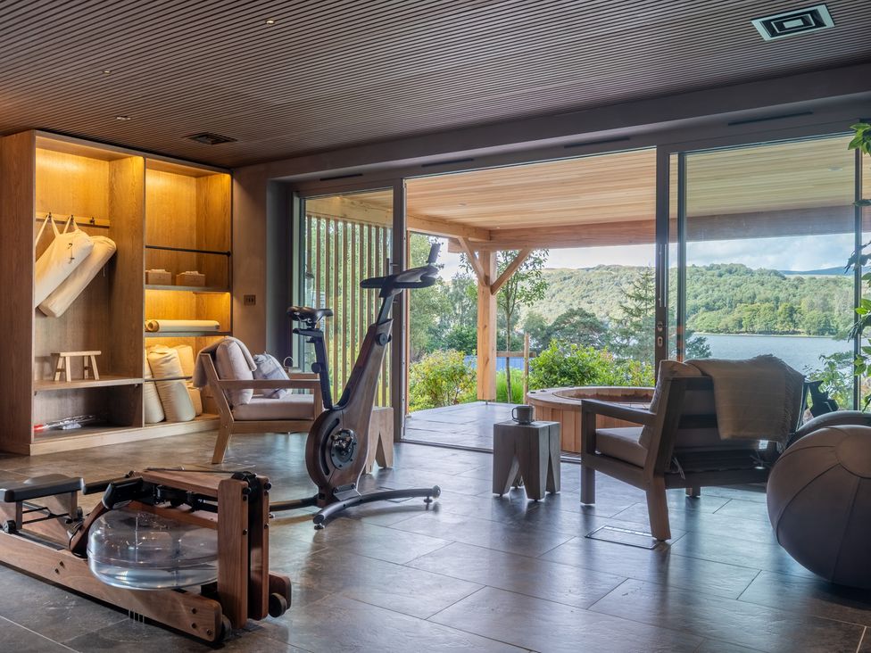 An indoor exercise area with fitness equipment and a view at Deer Close in Coniston