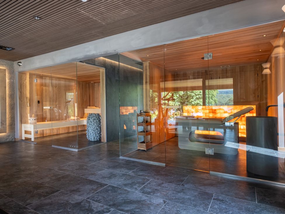 A spa area with sauna and treatment table at Deer Close in Coniston