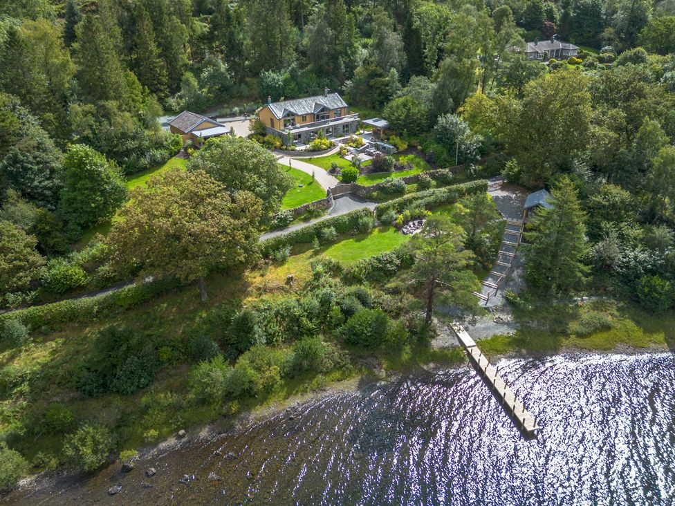 An overview of a house and garden with a dock at Deer Close in Coniston