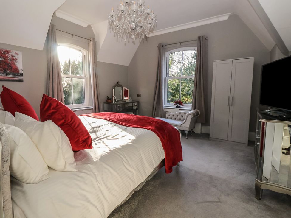 A bedroom with a bed and window at Ten Gables in Driffield