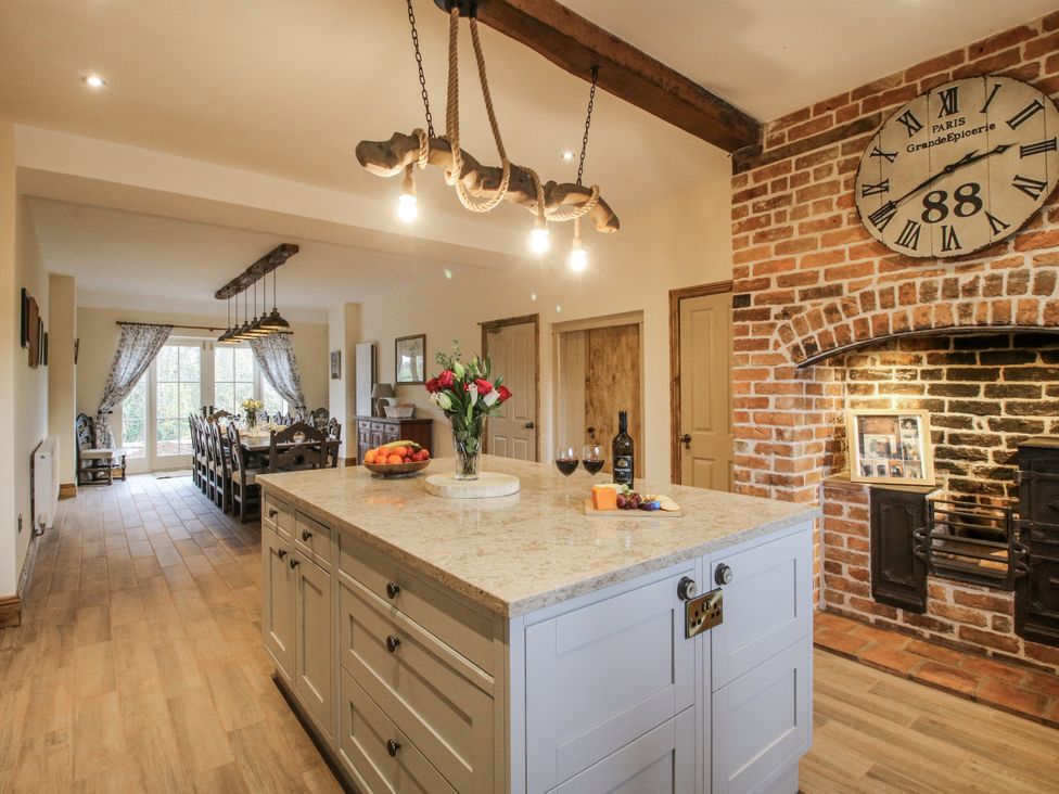 A kitchen with a large island and dining area at Highfields Farm Church Preen near Much Wenlock