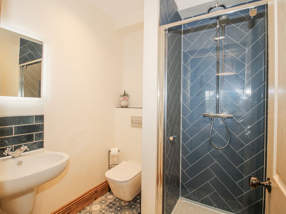 A bathroom with a shower and toilet at Highfields Farm in Church Preen near Much Wenlock