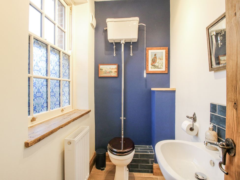 A bathroom with a toilet and wash basin at Highfields Farm Church Preen near Much Wenlock