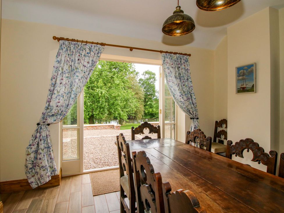 A dining room with a large table and chairs at Highfields Farm Church Preen near Much Wenlock