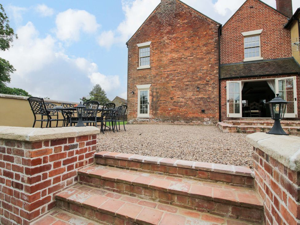 An outdoor area with furniture and steps at Highfields Farm Church Preen near Much Wenlock