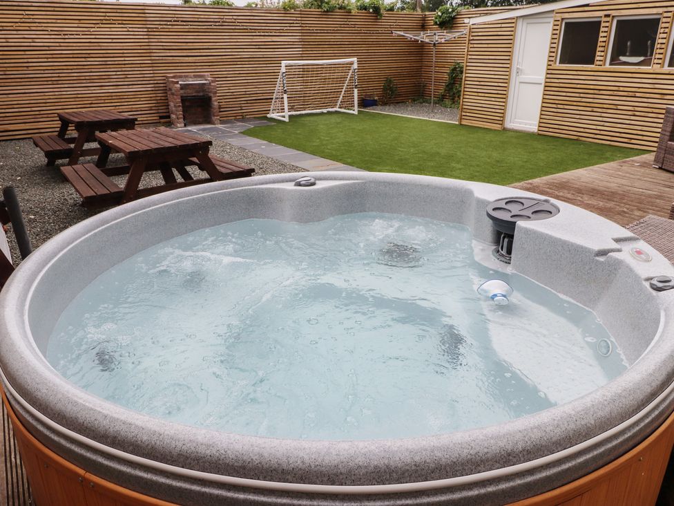 A hot tub in a garden with a goalpost at 51 Trinity Avenue Llandudno