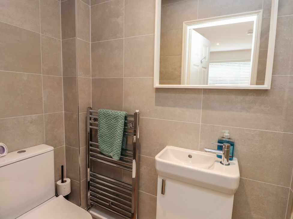 A bathroom with a sink and toilet at 40 Gloddaeth View in Penrhyn Bay