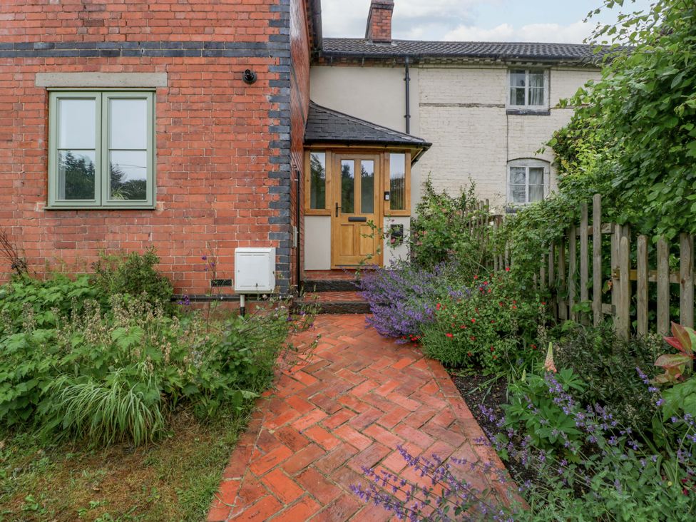 The entrance of a house with a path and garden at 2 Loxter Villas Wellington Heath near Ledbury