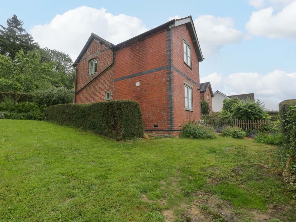 A brick house with a garden at 2 Loxter Villas in Wellington Heath near Ledbury